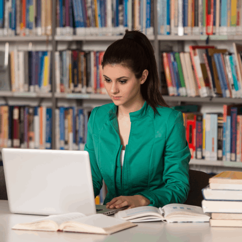 A student reviews certified transcripts on a desk while Translation Services in Hoboken checks formatting for submission.