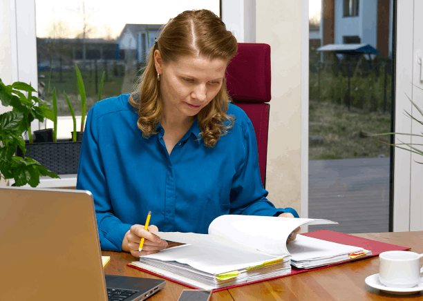 A translator checks a student transcript for accuracy using Translation Services in Union City for academic evaluation needs.