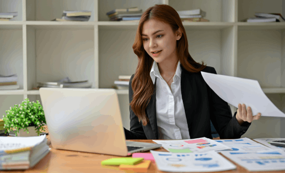 A translator proofreads a document for Translation Services in East Orange, focusing on affordable pricing and accuracy.