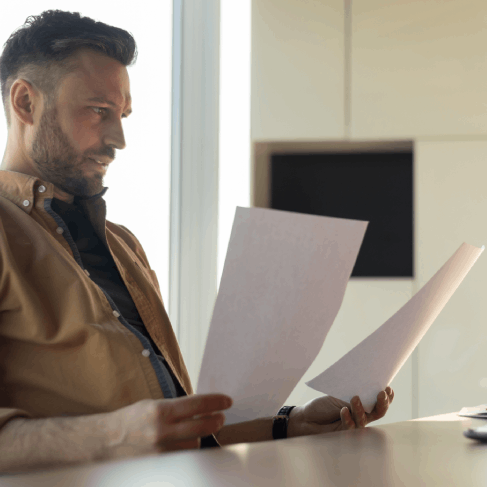 Client uploads certified translations to a USCIS portal on laptop, using Translation Services in Hoboken for compliance.