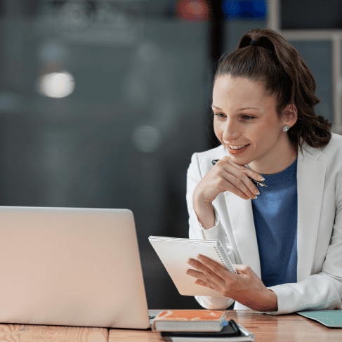 Translator preparing immigration documents using Certified translation services to help a client meet USCIS requirements.