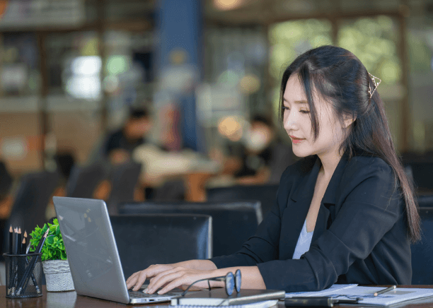 A translator certifies a contract at a desk, showing Chinese Translation Services in New Jersey for legal documents.