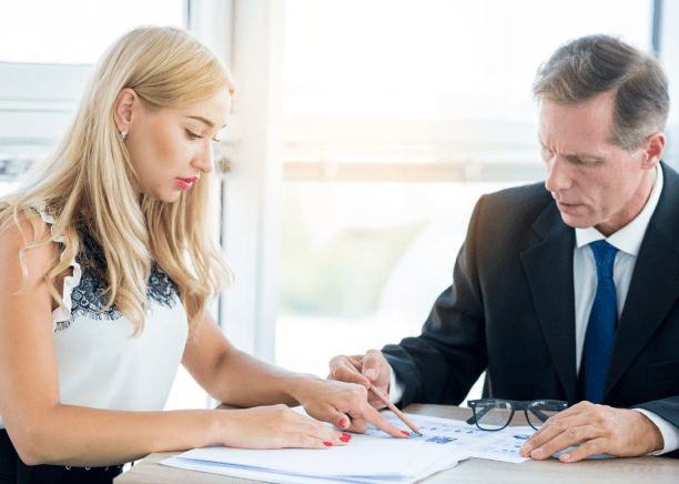 Customer receiving notarized marriage certificate translation with a notary stamp for legal and international use.