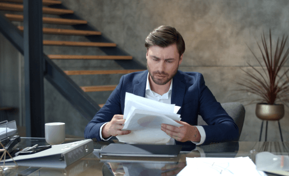 A translator providing certified documents for Portuguese Translation Services in New Jersey, preparing records for filing.