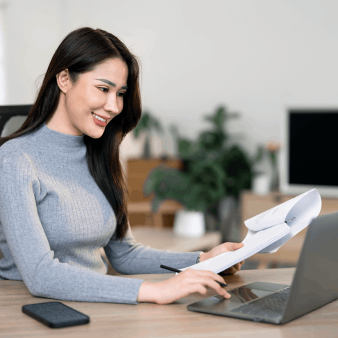 A client reviews an immigration application packet with certified pages, using Translation Services in Newark for USCIS.